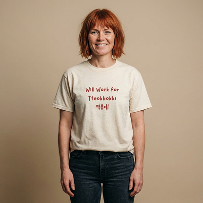 woman wearing “will work for tteokbokki” Korean street food fan beige t-shirt by Kjota