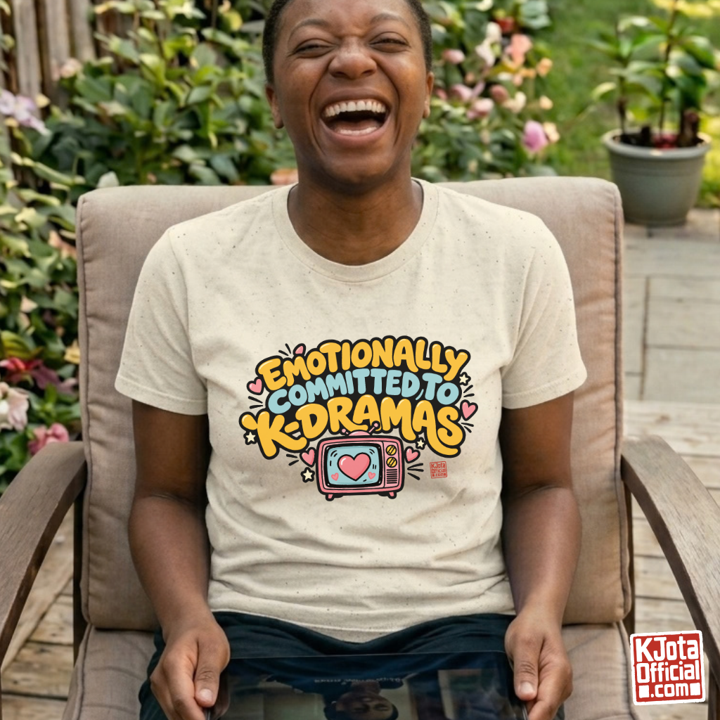 woman wearing “Emotionally Committed to K-dramas” printed on front of beige t-shirt, Korean show binge watching outfit by K-Jota