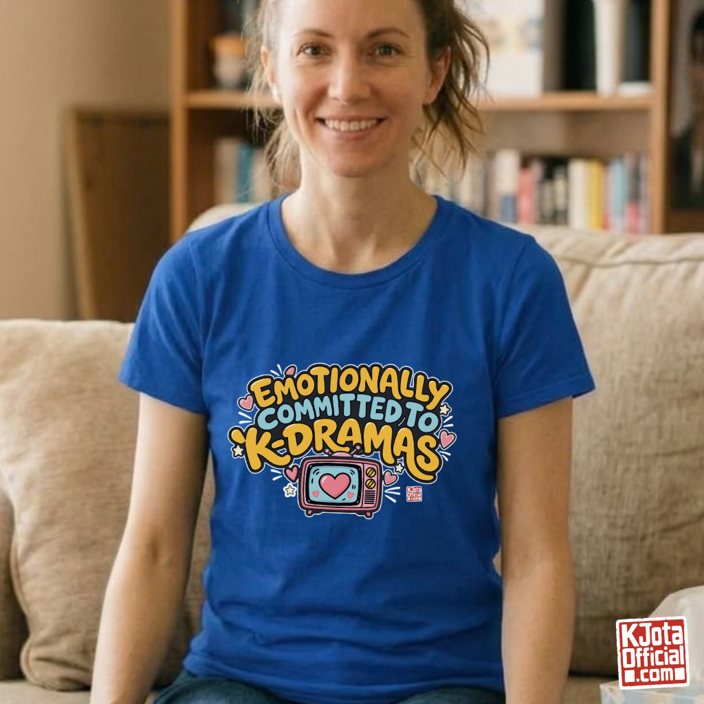 woman wearing “Emotionally Committed to K-dramas” printed on front of blue t-shirt, Korean show binge watching outfit by K-Jota