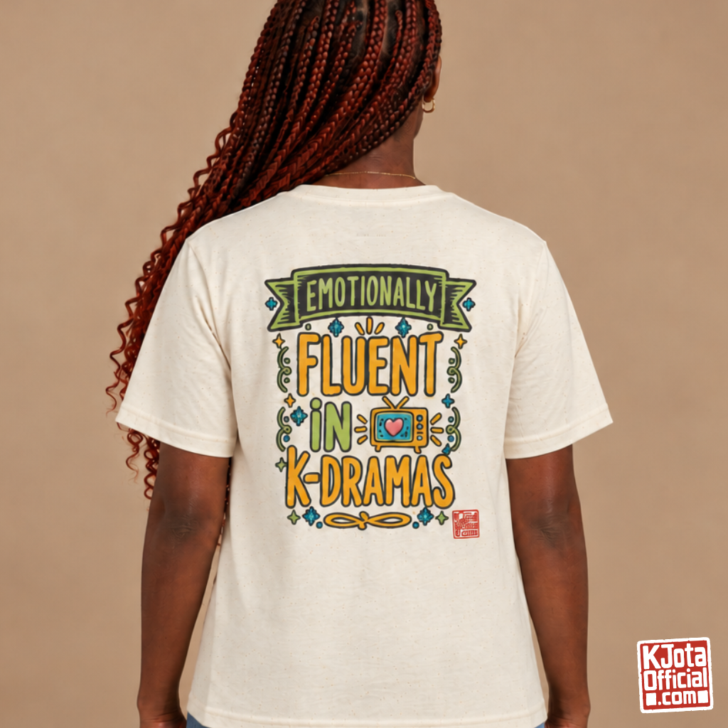 woman wearing a beige tee with “Emotionally Fluent in K-Dramas” printed on back, Korean show superfan identity binge watching t-shirt by K-Jota