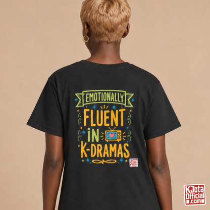 Woman wearing a black tee with “Emotionally Fluent in K-Dramas” printed on back, Korean show superfan identity binge watching t-shirt by K-Jota