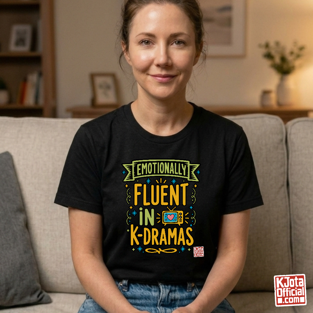 Woman wearing a black tee with “Emotionally Fluent in K-Dramas” printed on front, Korean show superfan identity binge watching t-shirt by K-Jota