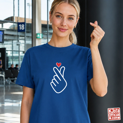 woman wearing finger heart Korean saranghaeyo I love you K-pop t-shirt blue by K-Jota and making finger heart gesture at airport